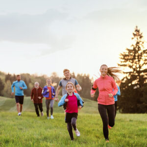 large group of people running cross country