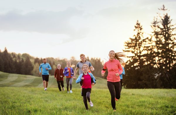 large group of people running cross country